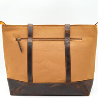 Tan tote bag with brown accents on a white background
