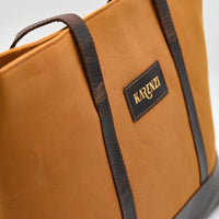 Brown bag with a visible brand logo on a white background