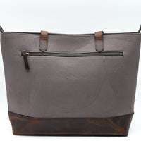 Gray tote bag with brown leather accents on a white background