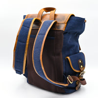 Blue backpack with brown straps and accents on a white background