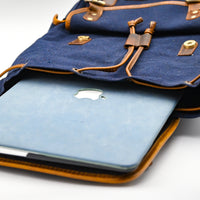 Blue laptop in a backpack with Apple logo on a white background