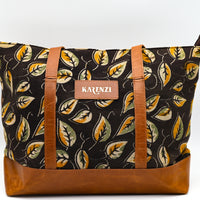 Bag with leaf pattern and brown accents on a white background