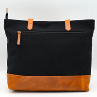 Black and brown bag with orange accents on a white background