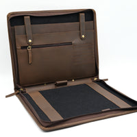 Brown leather briefcase with a black interior on a white background