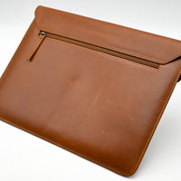Brown leather sleeve on a white background