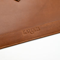Brown leather mouse pad with 'KARENZI' branding on a white background