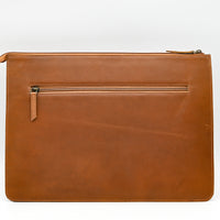 Brown leather pouch with a zipper on a white background