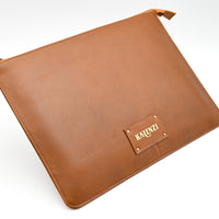 Brown leather pouch with 'KARENZI' brand logo on a white background