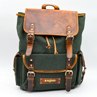 Green backpack with brown leather accents and 'Karenzi' branding on a white background